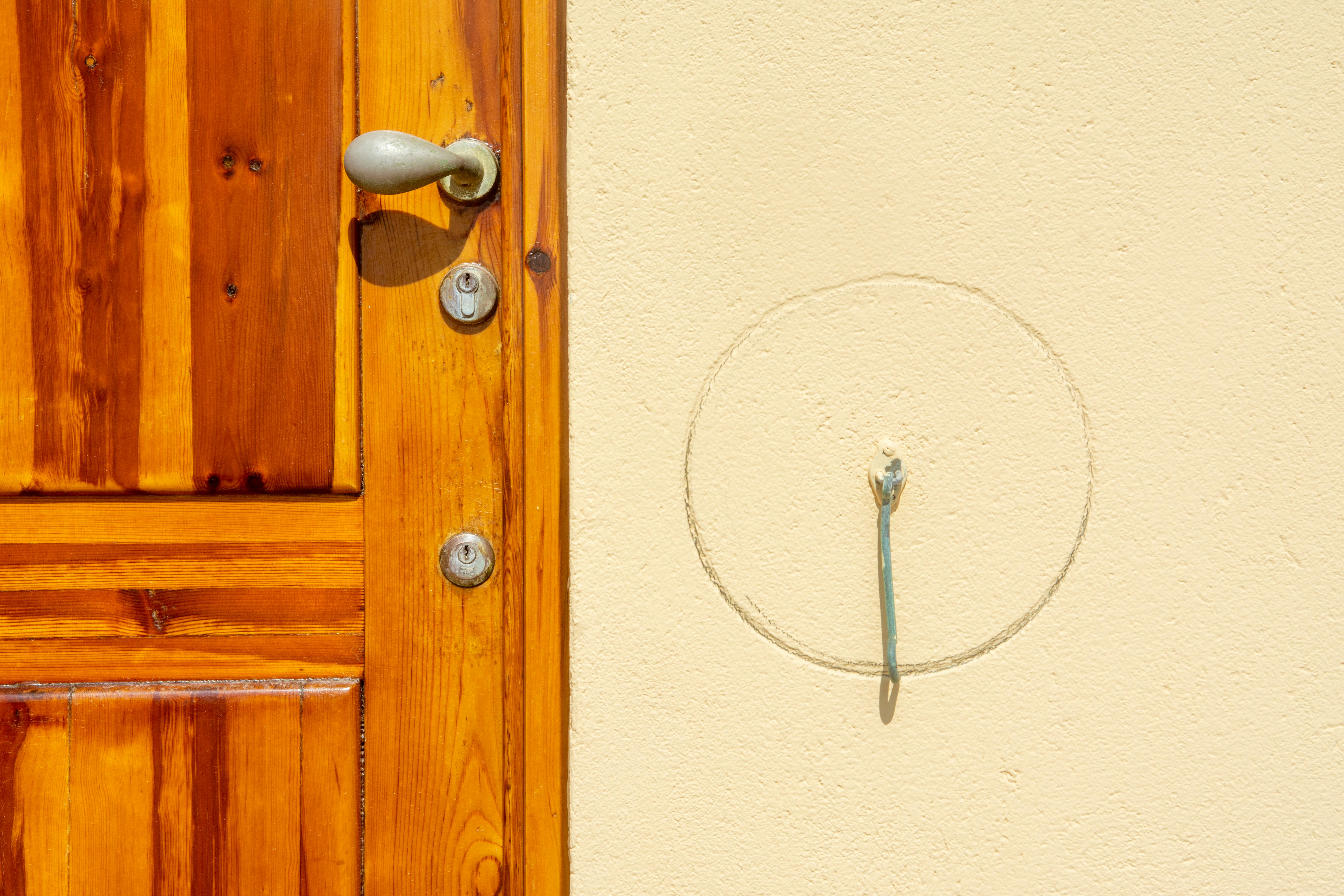 Wooden door with multiple locks
